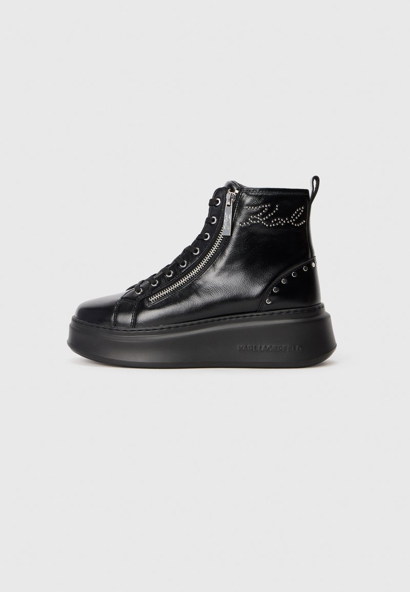 Black leather high-top sneaker boot with side zipper, lace-up front, studded detailing, and a thick platform sole.