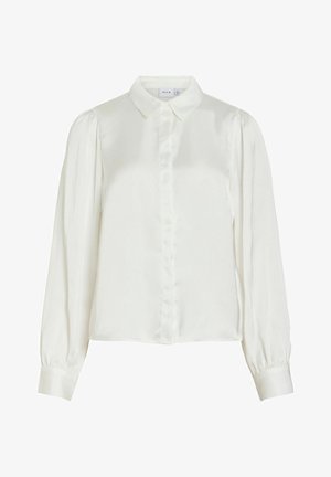 Bílá halenka s dlouhým rukávem, s špičatým límečkem, zapínáním na knoflíky vpředu, nařasenými rameny a širokými manžetami.