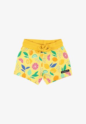 Gele peutershorts met elastische tailleband en trekkoord, versierd met kleurrijke citrusvruchten- en bladpatronen, met label "Villervalla" op het been.
