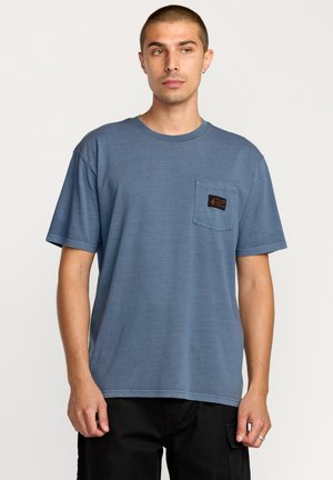 Blue cotton t-shirt with short sleeves, crew neckline, and a left chest pocket featuring a rectangular patch logo. Smooth texture.