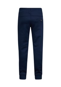 Marineblaue Jogginghose mit glatter Textur, schmal zulaufender Form, elastischem Bund und einer Gesäßtasche mit einem kleinen Logo-Detail.