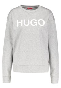 Sudadera gris de manga larga, con puños y dobladillo acanalados. Presenta un gran texto blanco "HUGO" en la parte delantera. Hecha de material de algodón suave.