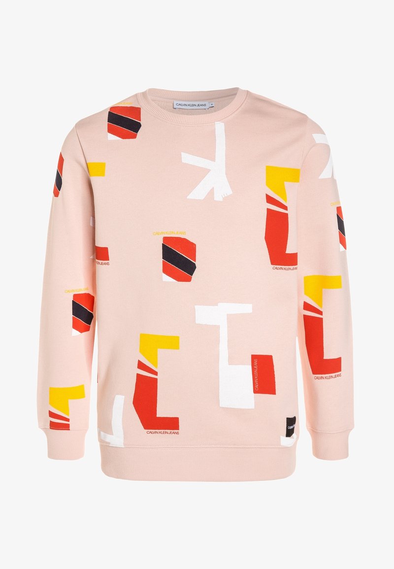 Sweat-shirt rose clair à manches longues avec des formes abstraites colorées rouges, jaunes, blanches et noires et la marque Calvin Klein Jeans.