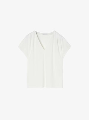Blusa bianca a maniche corte con scollo a V. Realizzata in tessuto liscio, presenta una vestibilità rilassata e un design minimalista, senza motivi o dettagli visibili.