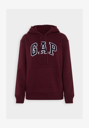 Burgunderfarget hettegenser med frontlomme, snøring i hetten og hvit brodert "GAP"-logo. Mykt stoff med ribbestrikkede mansjetter og kant.