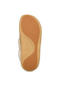 Pantofola slip-on con suola in gomma beige, dotata di grip testurizzato e modelli di battistrada curvi, visibili dal fondo.