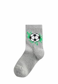 Calzino di cotone grigio con un design di un pallone da calcio in bianco e nero, con accenti di vernice verde a spruzzi sui lati.