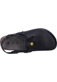 Black slip-on shoe with adjustable straps, cork footbed, and textured rubber outsole. Features a logo detail on the side. Size 41.