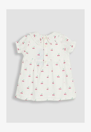 Bela obleka s kratkimi napihnjenimi rokavi in ovratnikom Peter Pan. Ima vzorec češenj, z malimi rdečimi češnjami in zelenimi listi. Zapiranje spredaj na gumbe.