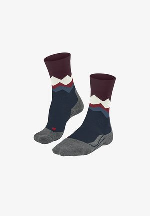 Two pairs of colorful socks featuring a maroon top, wavy mountain patterns in white, red, blue, and grey, with reinforced toes and heels.