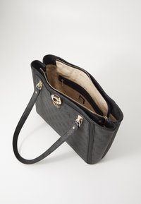 Black faux leather handbag with gold hardware, zip closure, two handles, and a beige logo-patterned interior featuring a zip pocket.
