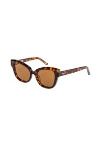 Gafas de sol tortoise con lentes marrones. Forma de ojo de gato y montura gruesa. Logo de Roxy en la patilla. Acabado texturizado.