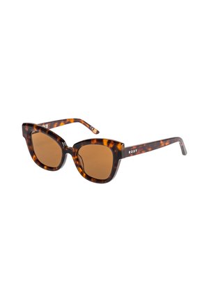 Gafas de sol tortoise con lentes marrones. Forma de ojo de gato y montura gruesa. Logo de Roxy en la patilla. Acabado texturizado.