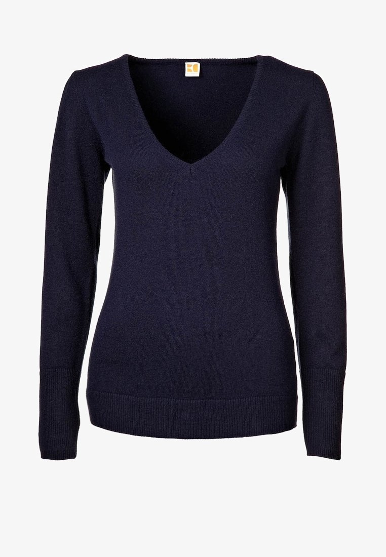 Pull bleu marine à manches longues avec col en V, poignets et ourlet côtelés, doté d'une petite étiquette rectangulaire au niveau de l'encolure.