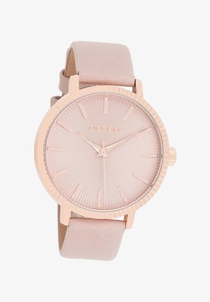 Montre-bracelet en or rose avec un bracelet en daim rose, lunette striée, cadran soleillé et marqueurs index minimalistes. Nom de la marque "OOZOO" affiché sur le cadran.