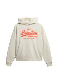 Crème-kleurige hoodie met een trekkoord, voorzien van oranje geborduurde tekst en accenten. Losse pasvorm met ribgebreide zoom en mouwen.