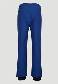 Pantalon d'extérieur bleu imperméable vu de dos avec ceinture ajustable et poignets élastiqués aux chevilles.