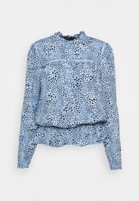Blouse bleu à manches longues avec encolure à volants et fermeture à boutons. Présente un motif étoilé en noir et blanc sur un fond bleu clair.