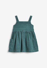 Tealowa sukienka z korduroju ma regulowane ramiączka, marszczony spód oraz dwie boczne kieszenie z pionowym teksturowaniem w prążki.