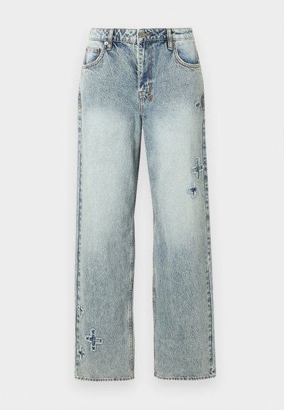 Light blue denim jeans with a straight-leg design, featuring visible stitching and decorative cross patterns on the front.