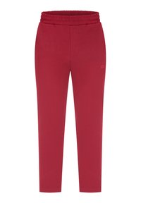 Rode joggingsbroek gemaakt van zachte stof met een elastische tailleband. Heeft een slim fit en stiksels aan de voor- en achterkant.