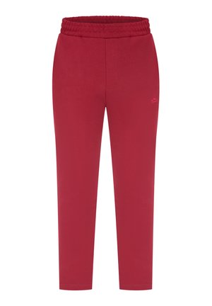 Pantaloni jogger rossi realizzati in un tessuto morbido con un elastico in vita. Presentano una vestibilità slim e dettagli di cucitura sulla parte anteriore e posteriore.