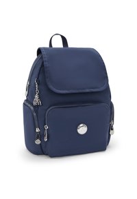 Navy blue nylon backpack with a fold-over flap, front zipper pocket, and silver hardware accents, including a charm and logo detail.