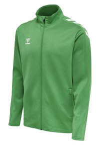 Veste de sport verte en tissu lisse, dotée d'un col montant, d'une fermeture éclair et d'accents blancs avec un logo sur la poitrine.