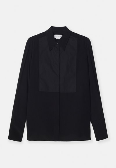 Black long-sleeve shirt made of smooth fabric, featuring a button-down collar and a contrasting panel at the front. Tailored fit.
