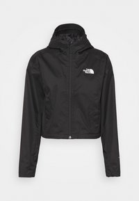 Veste à capuche noire zippée avec manches longues et logo The North Face sur la poitrine, affichée sur fond blanc.