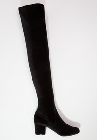 Botas negras sobre la rodilla hechas de suave terciopelo, con un tacón grueso y un diseño de punta redondeada. Construcción sin costuras en toda su extensión.
