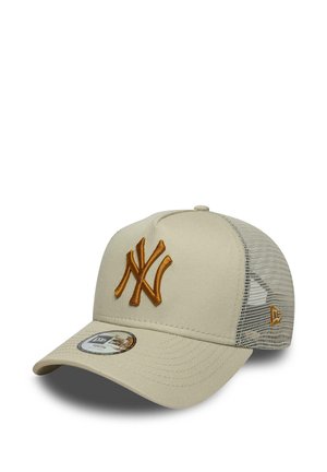 Beige baseball cap with orange embroidered NY logo on front, mesh back panels, and curved brim with a brand sticker.