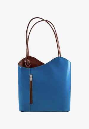 Blue leather handbag with two brown handles, a vertical brown zipper pocket on the front, and a curved top edge.