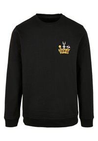 Čierna mikina s dlhými rukávmi a okrúhlym výstrihom. Obsahuje farebnú nálepku Looney Tunes a grafiku postáv na hrudi.