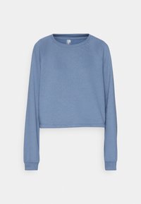 Sudadera corta de color azul claro, hecha de una tela suave, con mangas raglán largas y un escote redondo. Presenta puños y dobladillo acanalados.