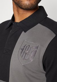 Umbro Polo - black/multi coloured