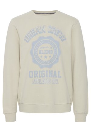 Felpa beige chiaro con maniche lunghe, collo a giro, e grande testo grafico blu con elementi di design "URBAN CREW" e "BLEND".