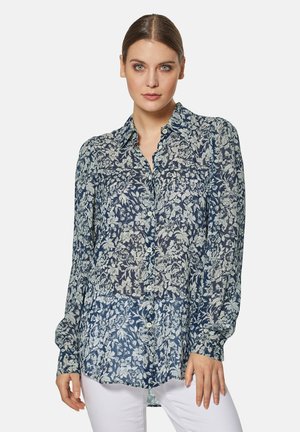 Marinebluse mit floralem Muster, aus leichtem Stoff, mit durchgehender Knopfleiste, langen Ärmeln und einem spitzen Kragen in lässiger Passform.