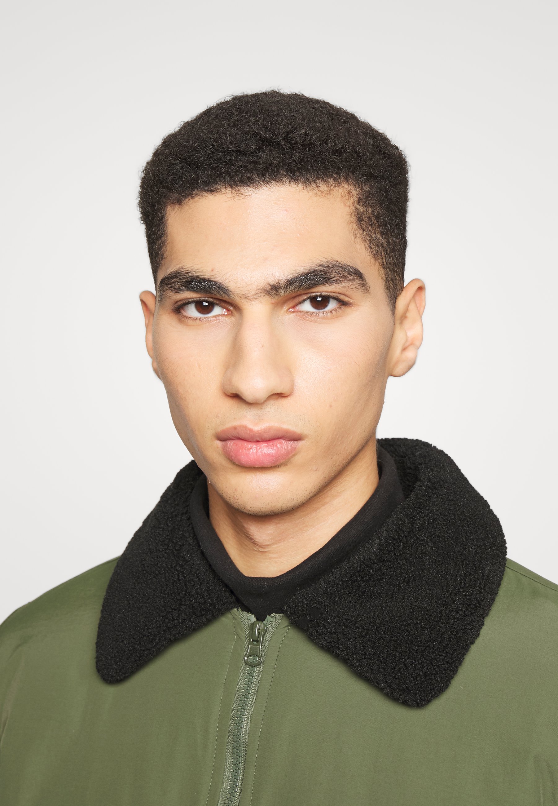 green collared jacket