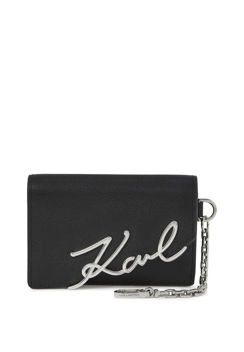 Black leather wallet featuring a silver metal signature "Karl" logo, with a chain accent and a compact rectangular design.