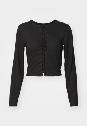 Black long-sleeve cropped top with a textured fabric, featuring a front opening with interlaced design and a round neckline.