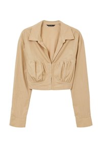 Maglietta beige accorciata con colletto, maniche lunghe e dettagli arricciati sul busto. Realizzata in tessuto liscio con una leggera lucentezza.