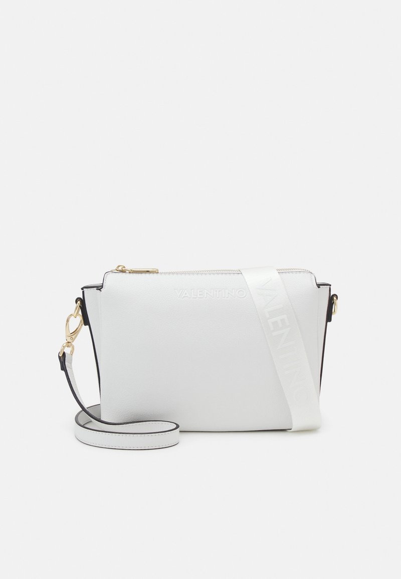 White leather handbag with gold hardware, black accents, a shoulder strap, and a printed "VALENTINO" logo on the strap. Zipper closure.