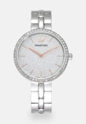 Hopeanvärinen Swarovski-rannekello, jossa kimaltava kellotaulu, ruusukultaiset osoittimet, kristallein koristeltu kehys ja metallinen linkkiranneke.