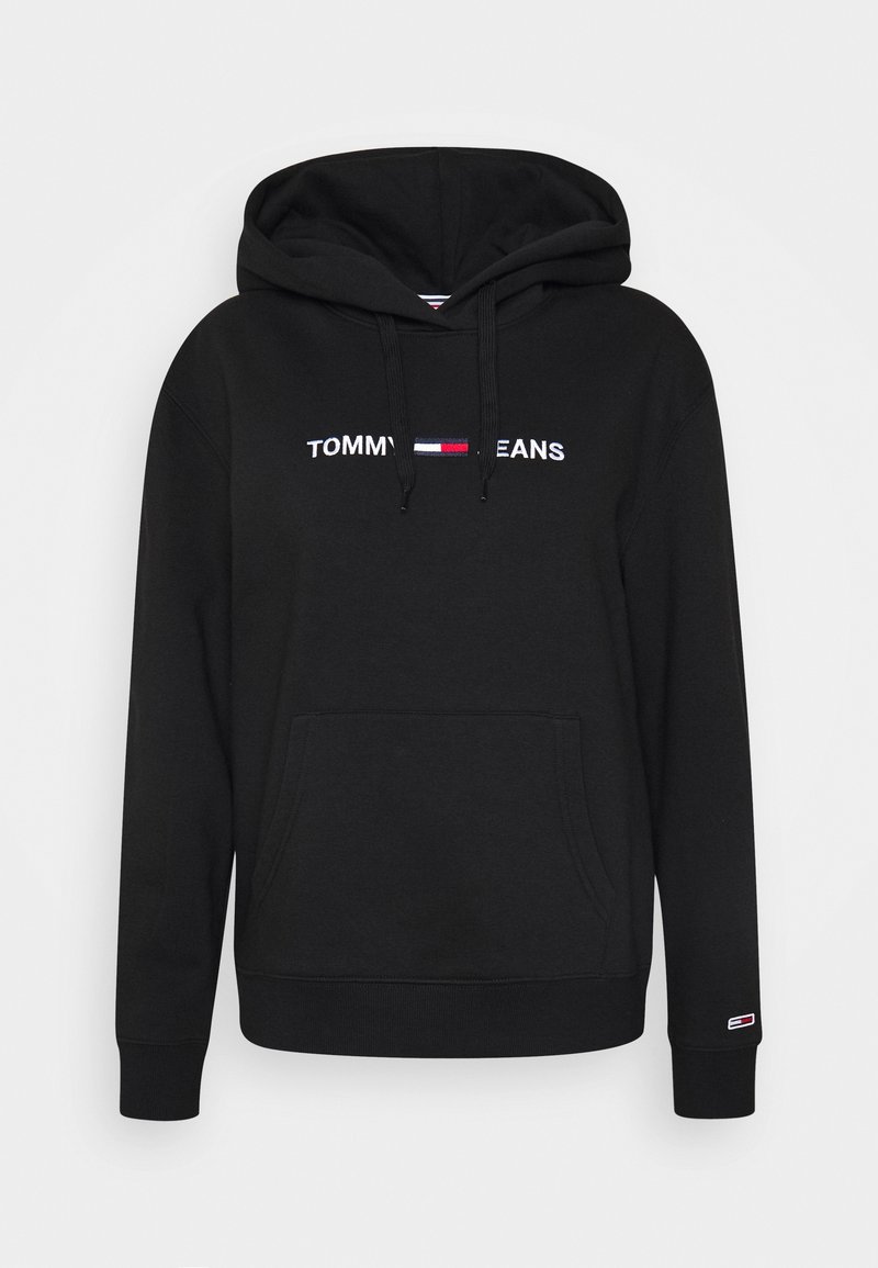 Sweat à capuche noir avec poche avant, cordons de serrage et logo "Tommy Jeans" centré au-dessus d'un emblème de drapeau rouge, blanc et bleu sur la poitrine.