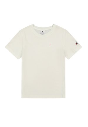 Camiseta de algodón color crema claro con mangas cortas, cuello redondo y un pequeño logo rojo en el pecho y la manga izquierda. Textura suave, diseño casual.