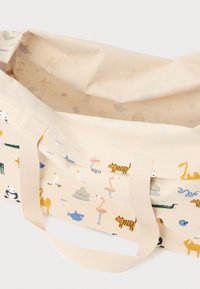 Canvas tas met dierenpatronen in pastelkleuren. Beige buitenkant met korte, stevige handvatten en een open bovenkant. Lichtgewicht, opvouwbaar ontwerp.