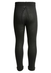 Zwarte gebreide legging met een geribde textuur, voorzien van een naadloze tailleband en boorden, ontworpen voor comfort en bewegingsvrijheid.