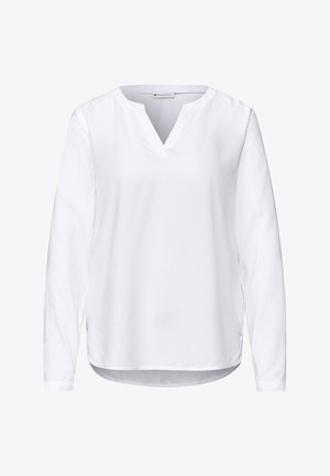 Witte blouse met lange mouwen en een v-hals, gemaakt van gladde stof. Heeft een iets gebogen zoom en knoopmanchetten. Eenvoudig, minimalistisch ontwerp.