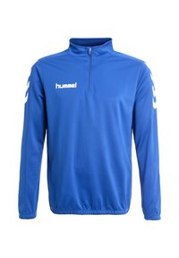 Pull-over de sport bleu à manches longues avec fermeture éclair au quart, ourlet élastique, logo hummel blanc sur la poitrine et bandes chevrons blanches sur les manches.